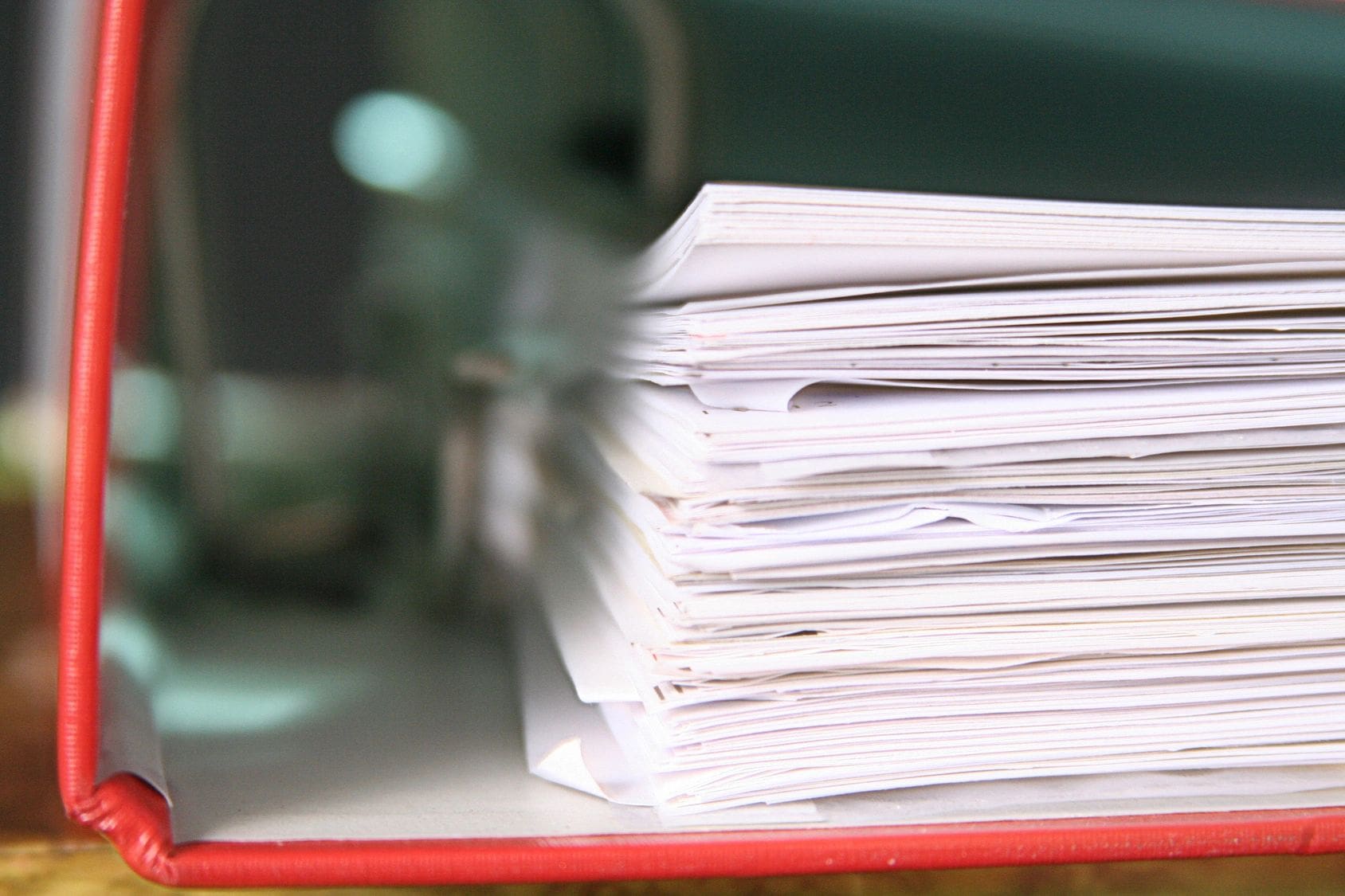 A stack of papers on top of a table.